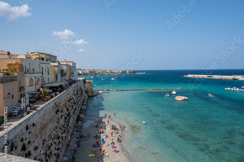 Otranto, Puglia, Italy. August 2021. Amazing view from the top of a panoramic point on the village: the gaze passes from the town to the sea and the marina.