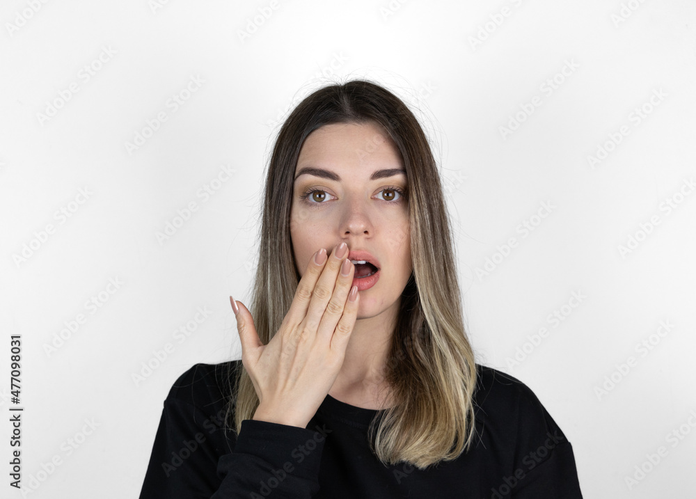 Shocked girl covering mouth with hand. Shocked girl covering mouth with hand.