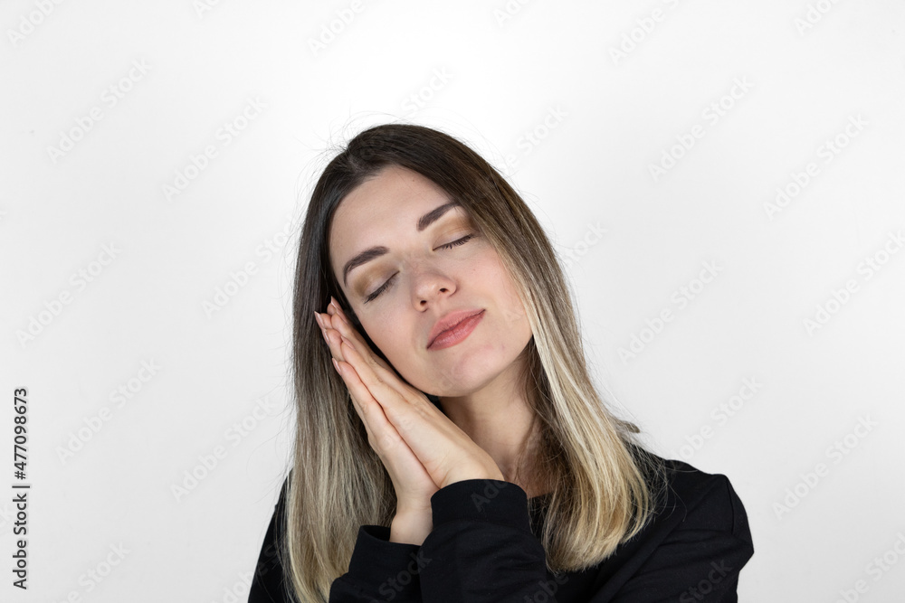 Girl hands cheek sleep gesture. Good night and have nice dreams. Peaceful photo white background isolated. Wish sweet dreams. Lullaby concept. Go to bed. Healthy lifestyle. Time to sleep. Eyes closed. Girl hands cheek sleep gesture. Good night and have nice dreams. Peaceful photo white background isolated. Wish sweet dreams. Lullaby concept. Go to bed. Healthy lifestyle. Time to sleep. Eyes closed.