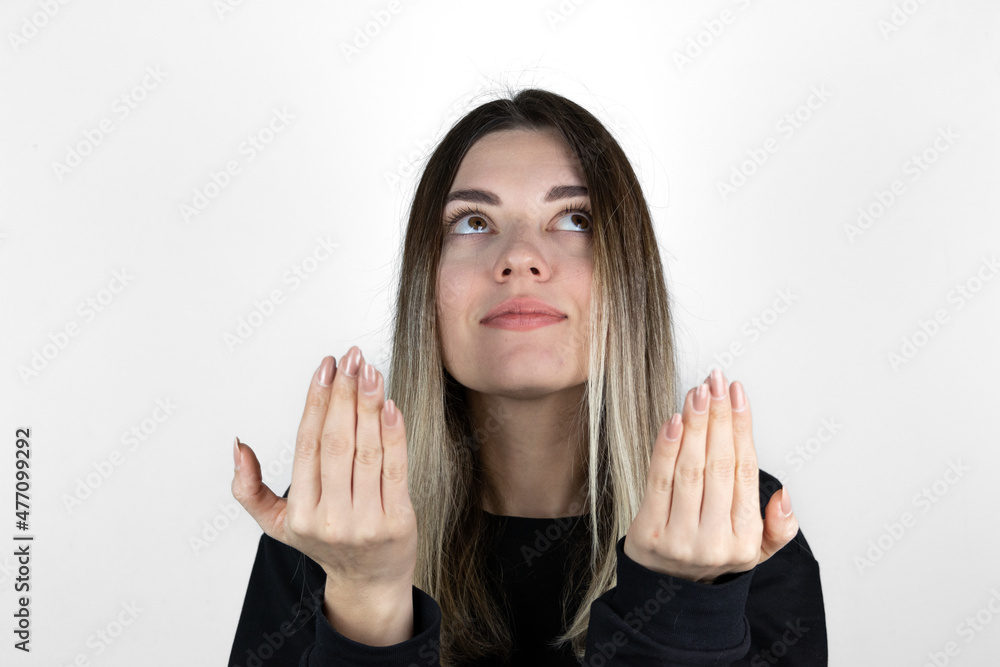 Muslim girl is rising hands and praying on white background. Copy and paste. Text space. Muslim girl is rising hands and praying on white background. Copy and paste. Text space.