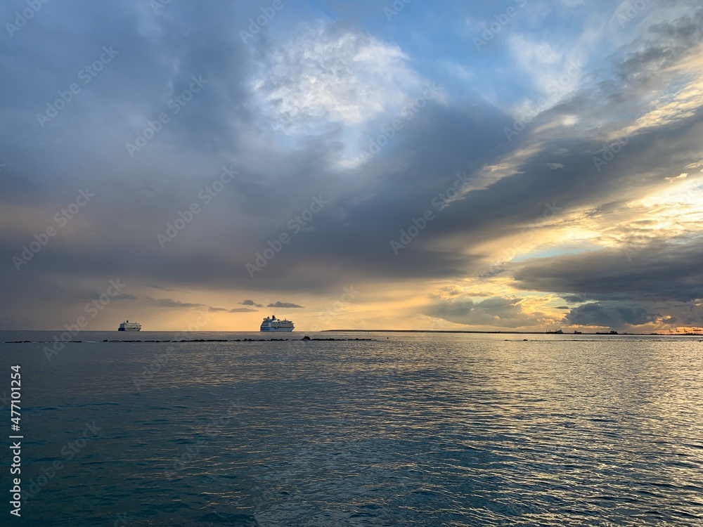 wonderful idyllic sunset at the sea, sea horizon with ships