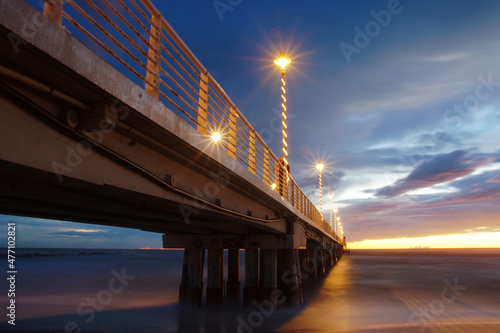 pier over the sea after the sunset in marina di massa