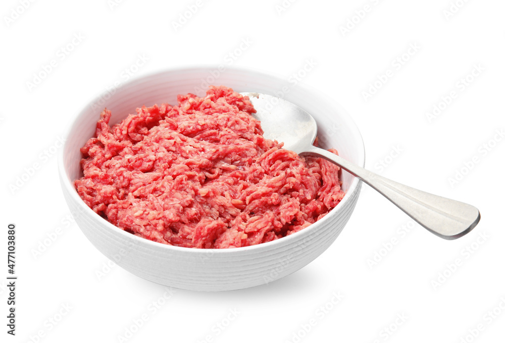 Fresh minced meat and spoon in bowl on white background Fresh minced meat and spoon in bowl on white background
