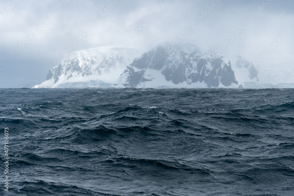 Antarctic waters with mountain in background Antarctic waters with mountain in background