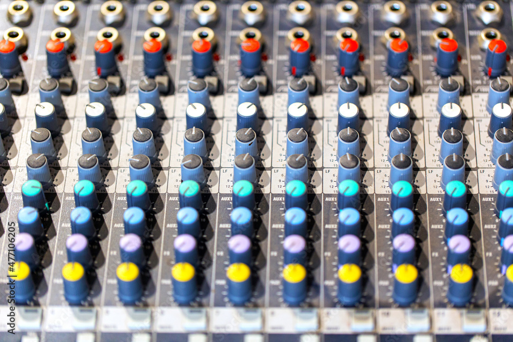 mixing console in music recording studio