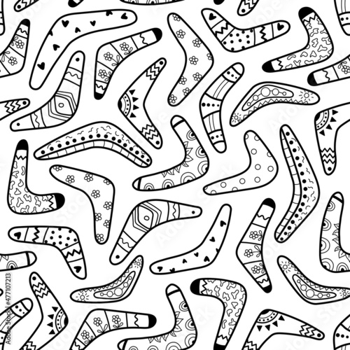 A pattern of boomerangs of different shapes and with different patterns on a white background. Traditional souvenir and Australian native symbols. Hand-drawn. Vector illustration.