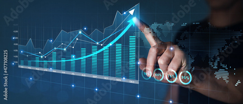Businessman draws economic growth graph financial data.Stock market investment. Financial and banking Technology. Business strategy and digital marketing concept. 