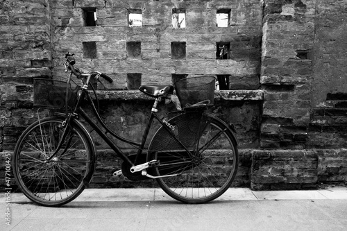 old bicycle in front of wall © LukasStefan