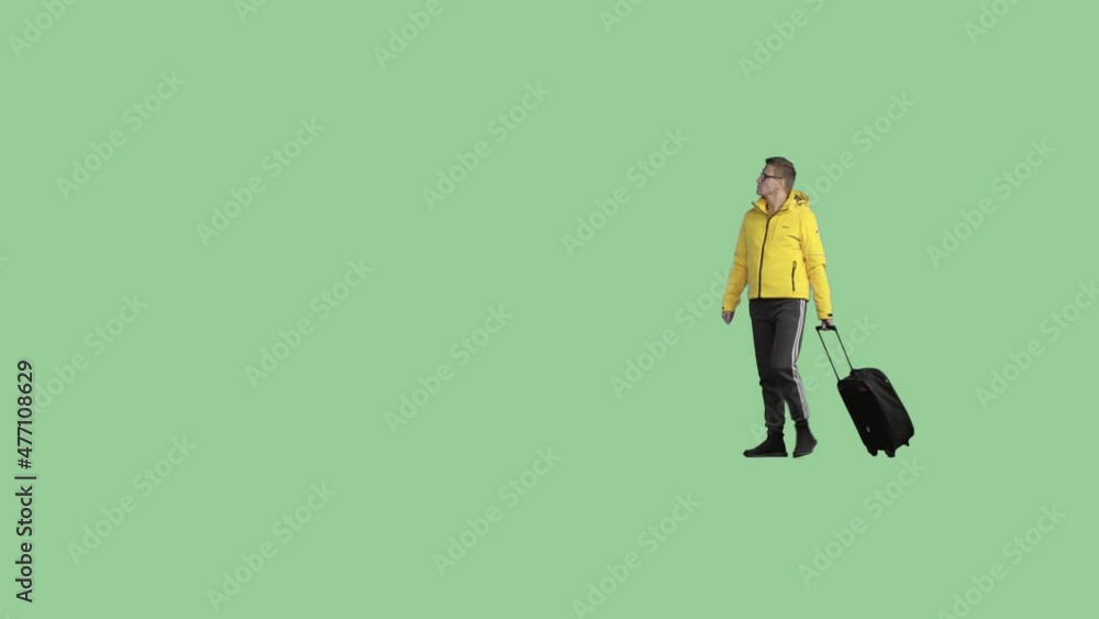 A man with a bag on wheels is walking and looking around. Transparent background A man with a bag on wheels is walking and looking around. Transparent background