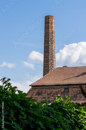 Old brick tall chimney of a former sugar factory. Old preserved factory in Zidlochovice (Czech Republic) photo