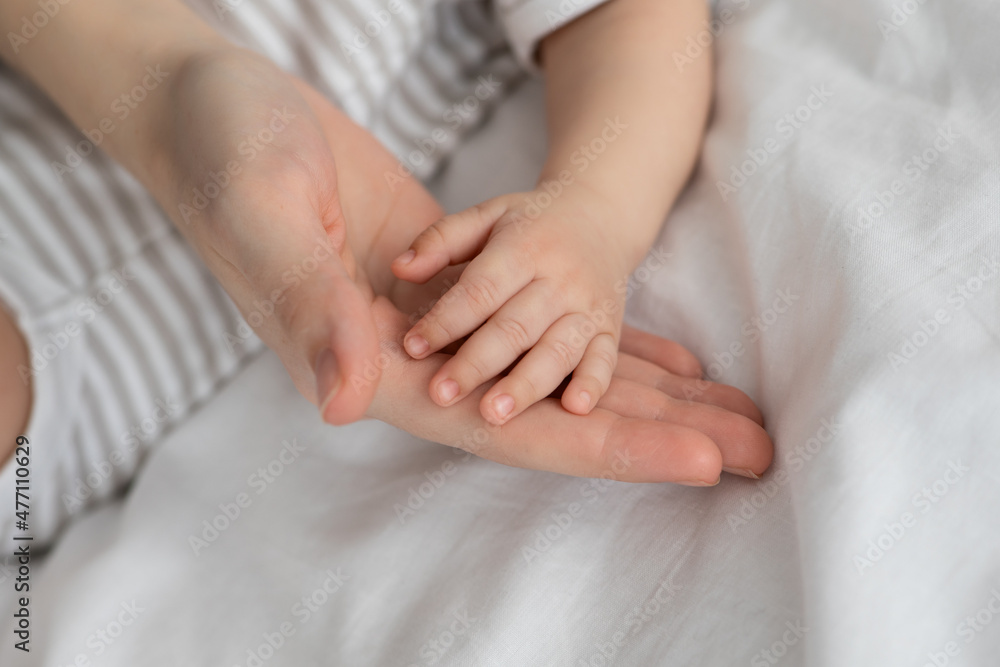 Mother Baby Connection. Mom And Little Newborn Baby Joined Hands Together, Mother Baby Connection. Mom And Little Newborn Baby Joined Hands Together,