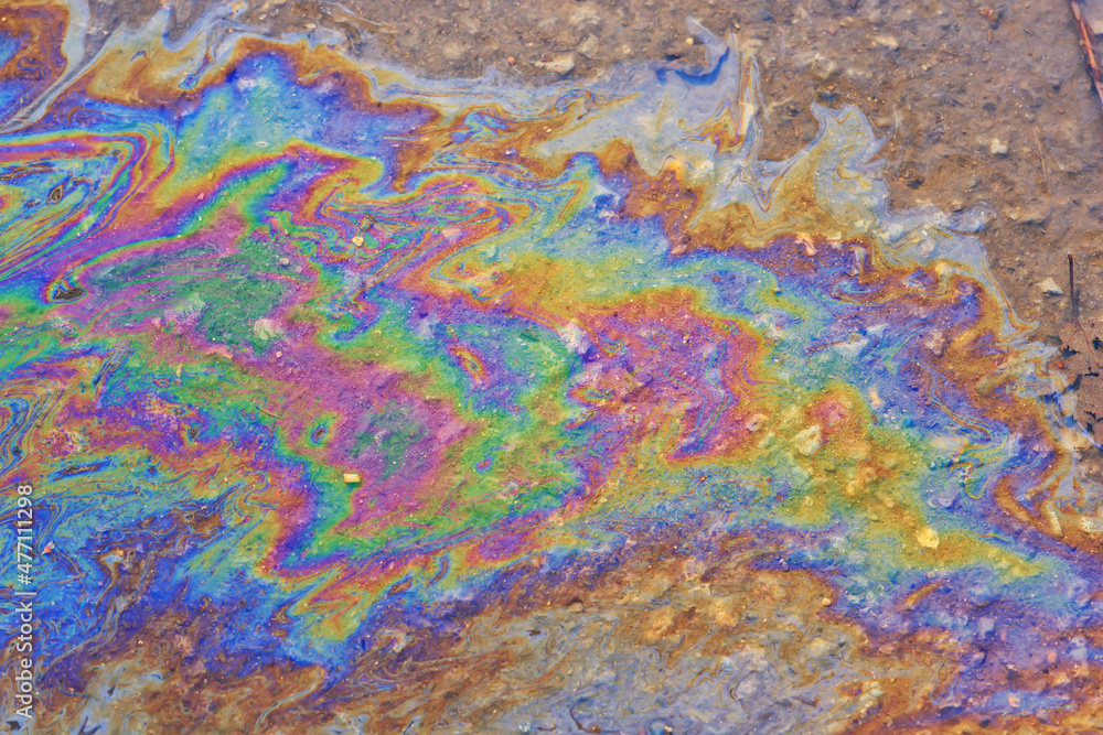 spilled gasoline rainbow background, industrial hazard spill pollution, abstract texture multicolored