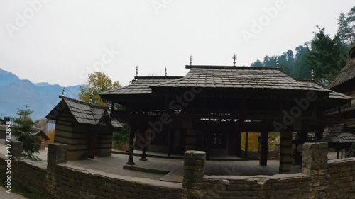 View of the Tripura Sundari Temple near Naggar Castle at Naggar in Himachal Pradesh, India. Ancient Temple made from wood with delicate carvings. Pagoda Style temple near Manali. photo