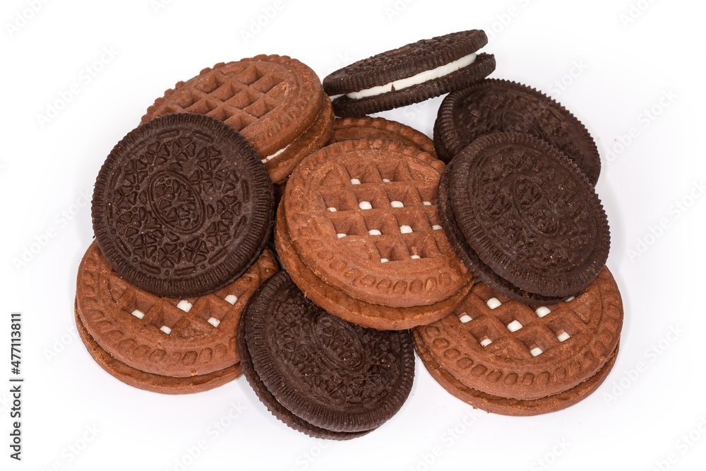 Different dark round sandwich cookies on a white background Different dark round sandwich cookies on a white background