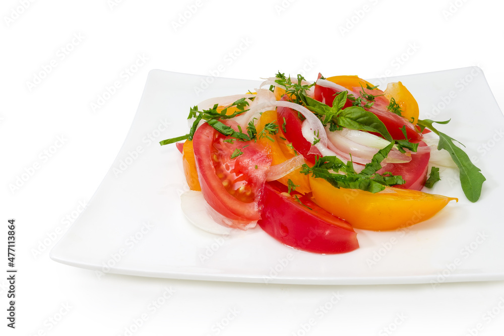 Tomato salad on square dish on white background, close-up