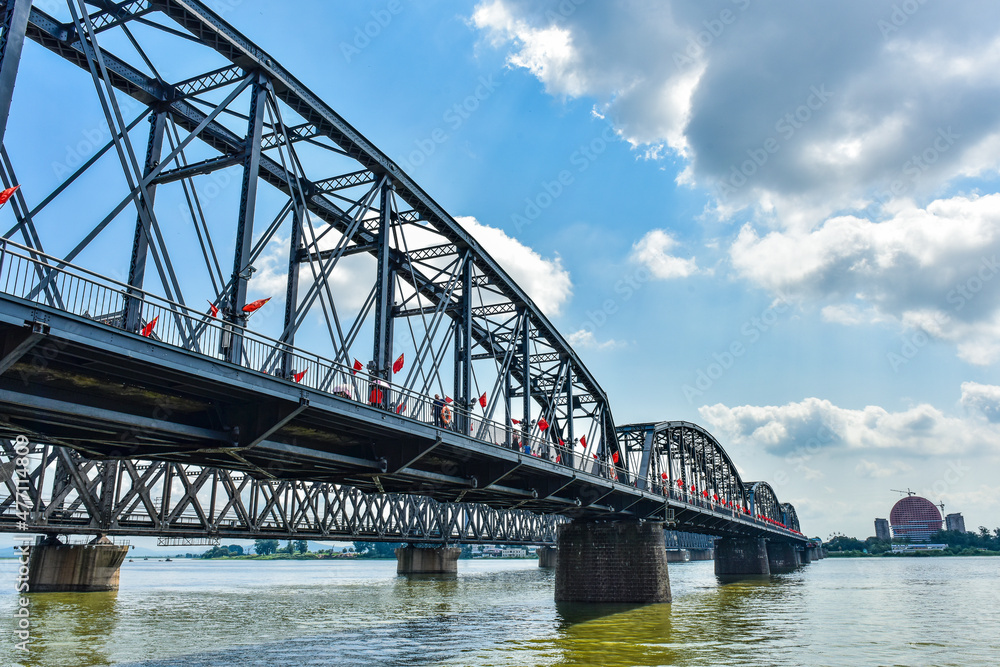 At the broken bridge site of Yalu River in Dandong, China, the Chinese on the plaque is translated into English: 