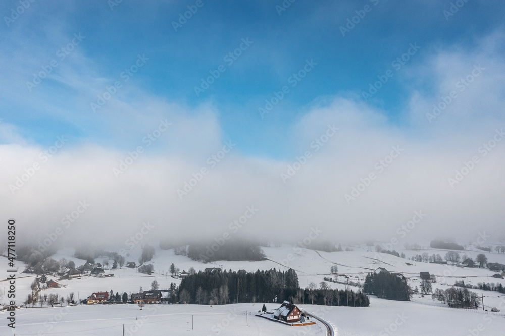 Snow-covered landscape at Christmas time in Hinterzarten in the Upper Black Forest, Germany Snow-covered landscape at Christmas time in Hinterzarten in the Upper Black Forest, Germany