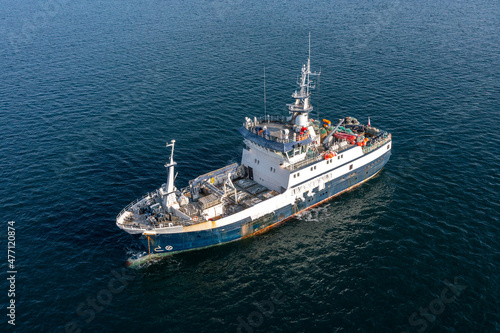 The fishing vessel to the sea.