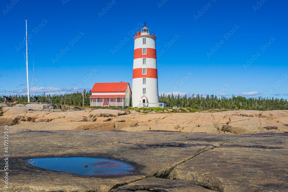 View on the Pointe des Monts lighthouse, the most famous lighthouse of Cote region of Quebec, Canada View on the Pointe des Monts lighthouse, the most famous lighthouse of Cote region of Quebec, Canada