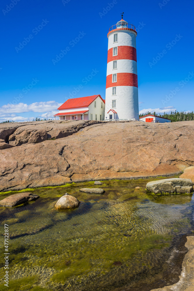 View on the Pointe des Monts lighthouse, the most famous lighthouse of Cote region of Quebec, Canada