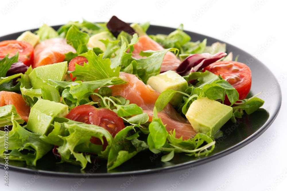 Salmon and avocado salad isolated on white background	