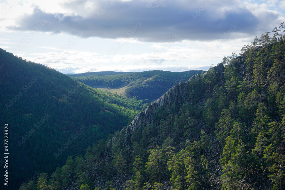 Rocky mountains in the forest of Olkhon island
