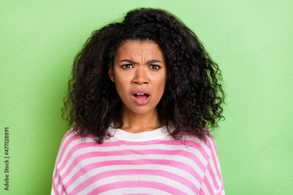 Photo of young pretty woman impressed negative stupor fail problem isolated over green color background Photo of young pretty woman impressed negative stupor fail problem isolated over green color background
