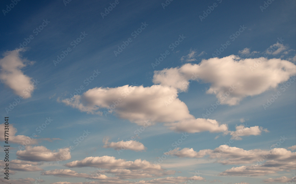 Soft pink clouds on the background of blue sky. On the sunset of the sunny day. Postcard, Wallpaper, Abstract Decoration Theme. Freedom concept. High quality photo Soft pink clouds on the background of blue sky. On the sunset of the sunny day. Postcard, Wallpaper, Abstract Decoration Theme. Freedom concept. High quality photo