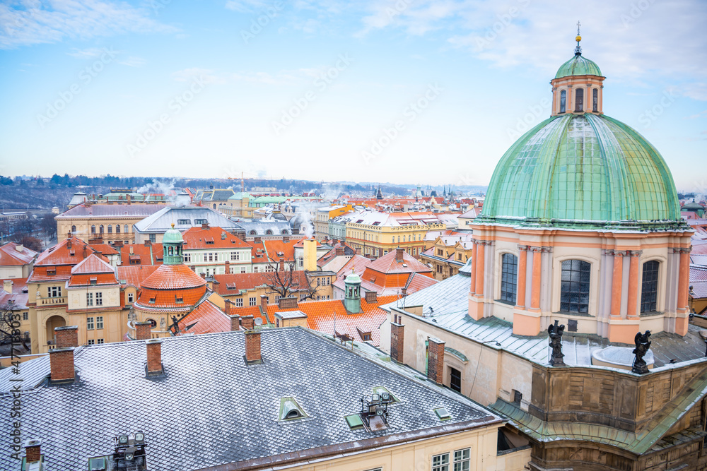 Panorama of Prague roofs covered with snow in winter, Czech Republic