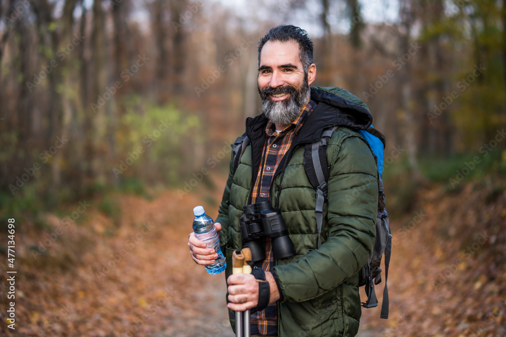 Image of man drinking water while hiking. Image of man drinking water while hiking.
