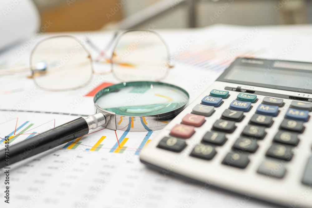 Calculator on chart and graph spreadsheet paper. Finance development, Banking Account, Statistics, Investment Analytic research data economy, Stock exchange trading, Business company concept. Calculator on chart and graph spreadsheet paper. Finance development, Banking Account, Statistics, Investment Analytic research data economy, Stock exchange trading, Business company concept.