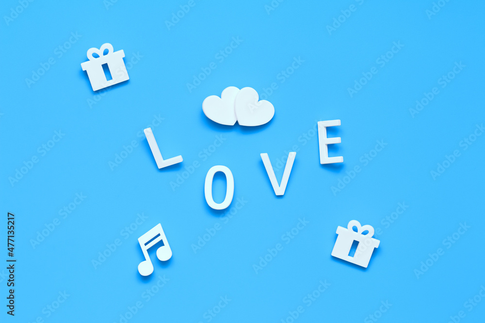 two hearts, gifts, note, the word LOVE. background blue two hearts, gifts, note, the word LOVE. background blue