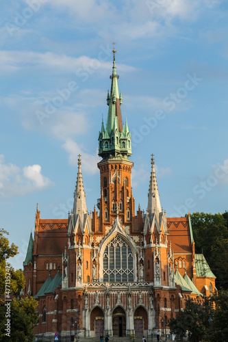 View of the church of St. Józefa in the Podgórze district in Krakow, a church with an impressive brick façade in the Neo-Gothic style.