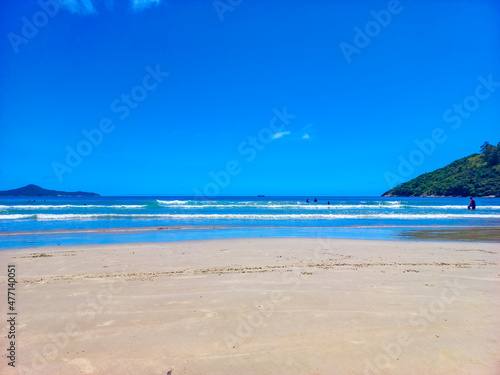 beach with sky of the Concei    o beach  Bombinhas  state of Santa Catarina  Brazil