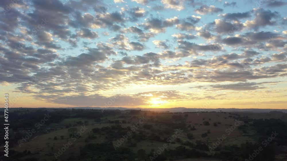 Sunset aerial scenery of farming landscape at rural countryside. Green background and field scene. Sunset aerial scenery of farming landscape at rural countryside. Green background and field scene.