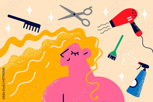 Happy woman satisfied with hairstyle in hair saloon 