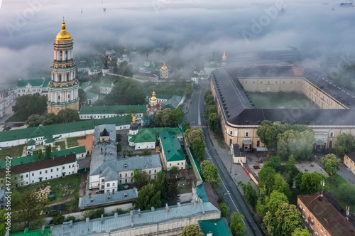 Aerial view of the Kiev-Pechersk Lavra at dawn, covered with thick fog. Kiev, Ukraine