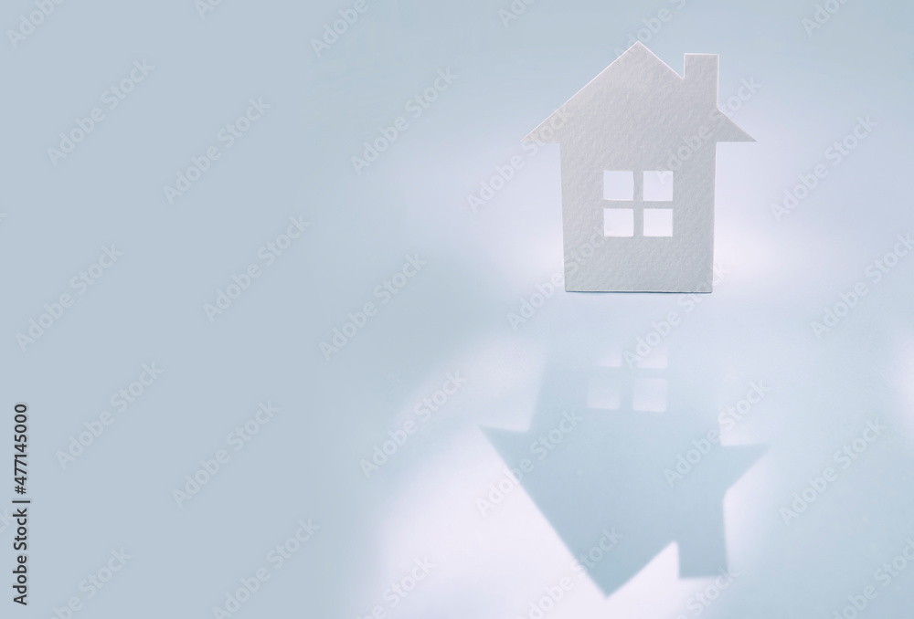 white paper house, homeless housing and home protection insurance concept, international day of families, foster home care, family, and real estate. white paper house, homeless housing and home protection insurance concept, international day of families, foster home care, family, and real estate.