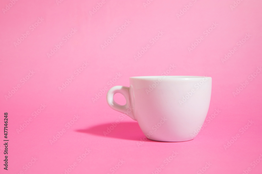 white cup of coffee on a pink background
white cup of coffee on a pink background