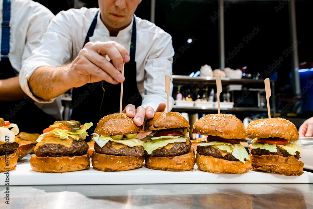 front view of delicious juicy hamburgers with meat cutlet and vegetables front view of delicious juicy hamburgers with meat cutlet and vegetables