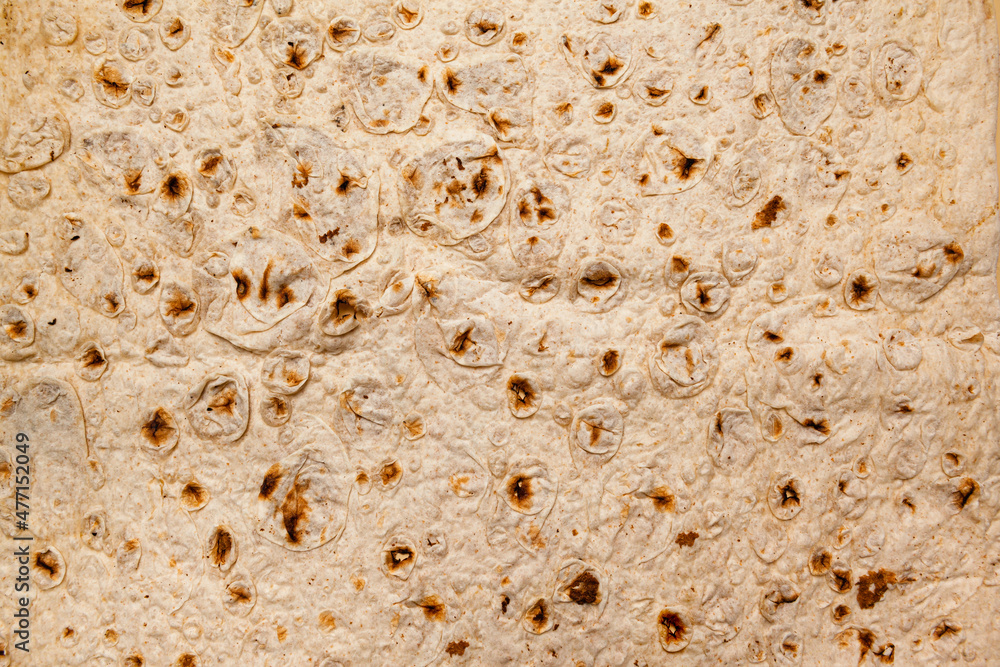food background - close-up of thin lavash made from wheat flour