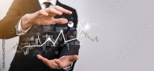 Hand hold sales data and economic growth graph chart. Business planning and strategy. Analysing trading of exchange. Financial and banking. Technology digital marketing.Profit and growing plan.