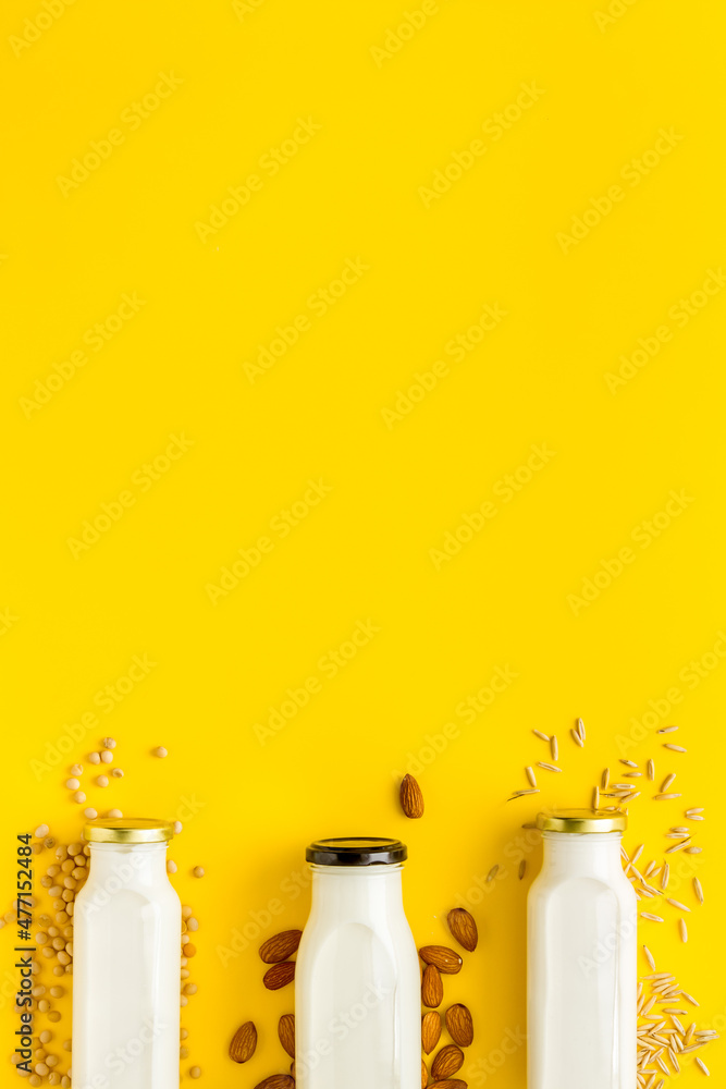 Non dairy vegan milk with ingredients - almonds rice and oats Non dairy vegan milk with ingredients - almonds rice and oats