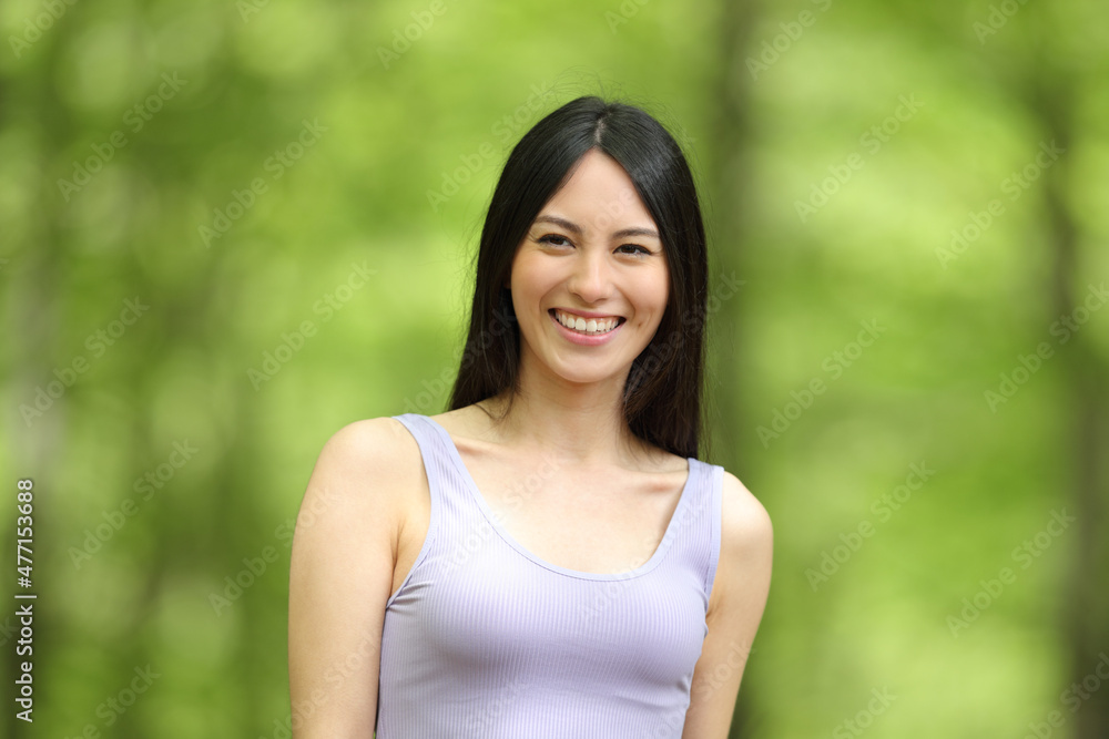 Happy asian woman smiling looking at camera Happy asian woman smiling looking at camera