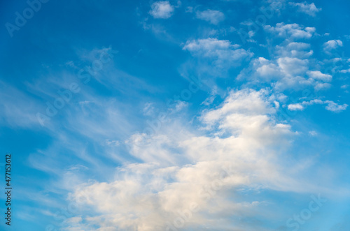Blue sky with soft puffy clouds