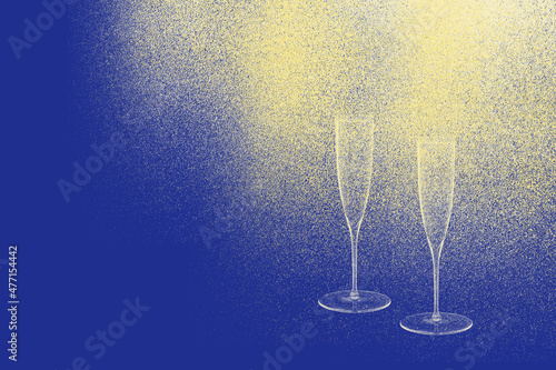 Kieliszki szampana na niebieskim tle.