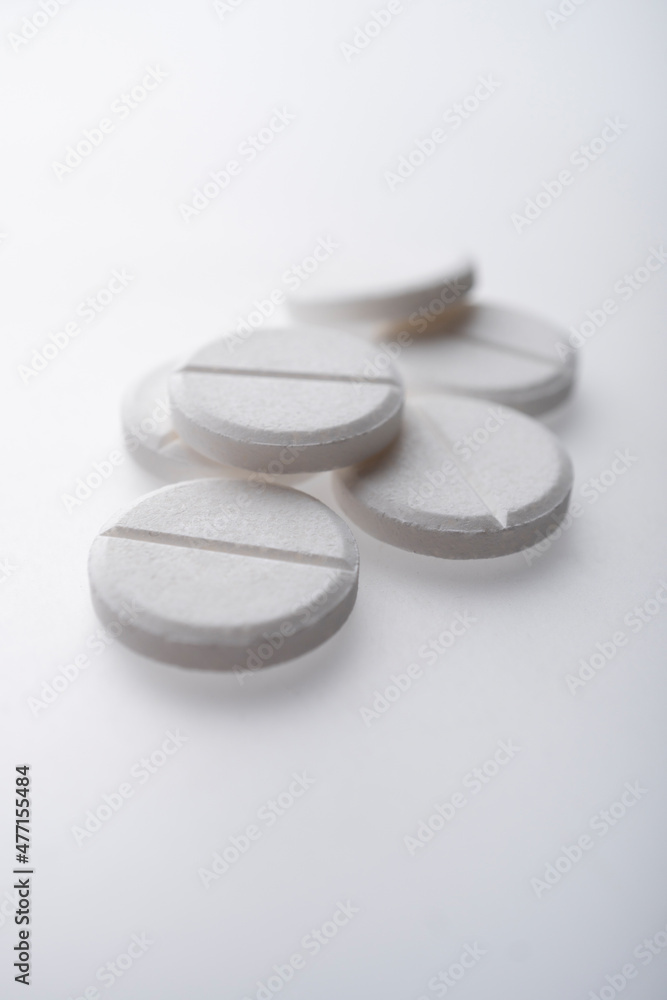 Close up of white pills Close up of white pills