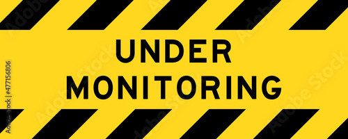 Yellow and black color with line striped label banner with word under monitoring