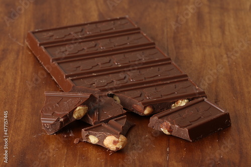 Milk chocolate with hazelnuts and almonds. Chocolate with nuts. 