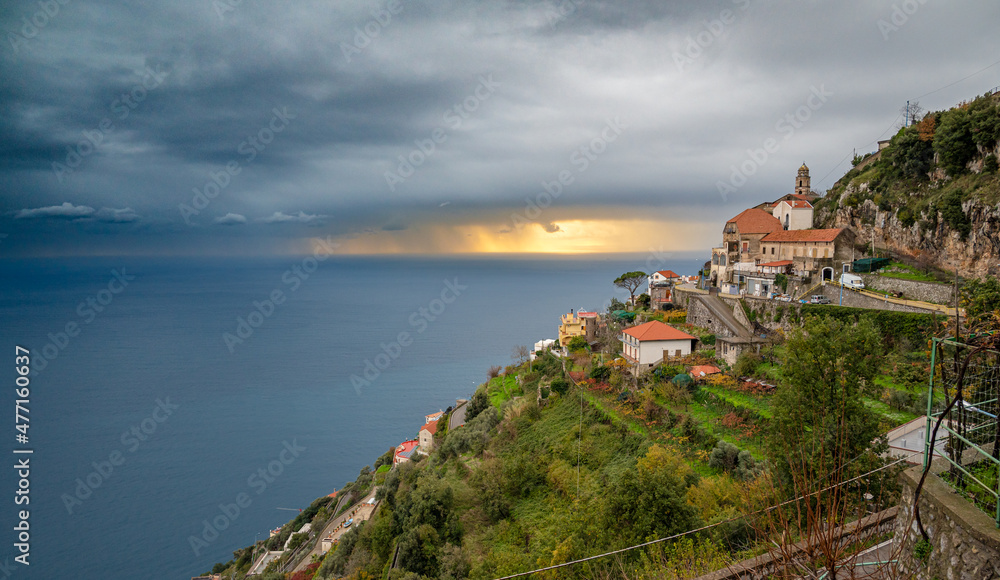 Amalfi coast near Furore, San Michele, Amalfi Coast, Italy, with Tyrrhenian Sea and sunset behind gray clouds